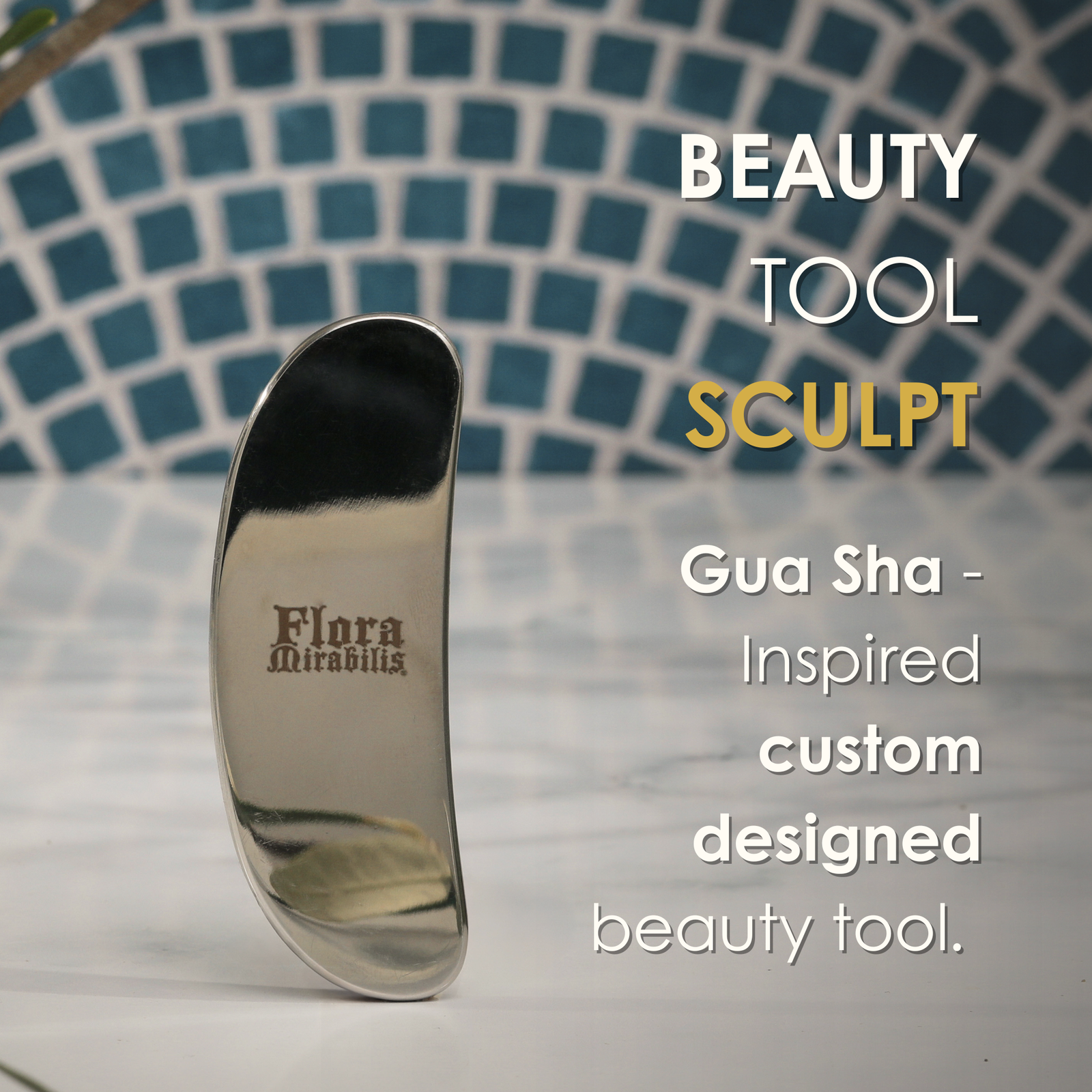 Flora Mirabilis stainless steel Beauty Tool standing upright with text overlay describing it as a custom Gua Sha–inspired sculpting tool.