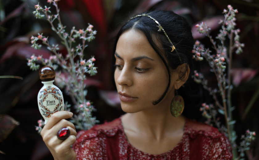 Jordan_inspecting_Holy_Grail_Face_Oil_and_ready_to_answer_questions_from_customers. - Flora Mirabilis