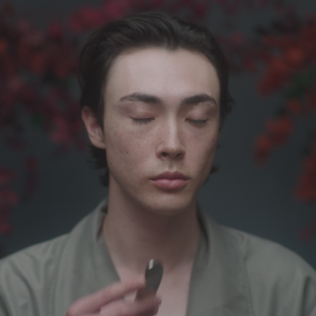 Video with model using Stainless Steel Beauty Tool with Holy Grail Face Oil to perform a Gua Sha-inspired lymphatic facial massage to support lymphatic drainage to sculpt and tone the face.