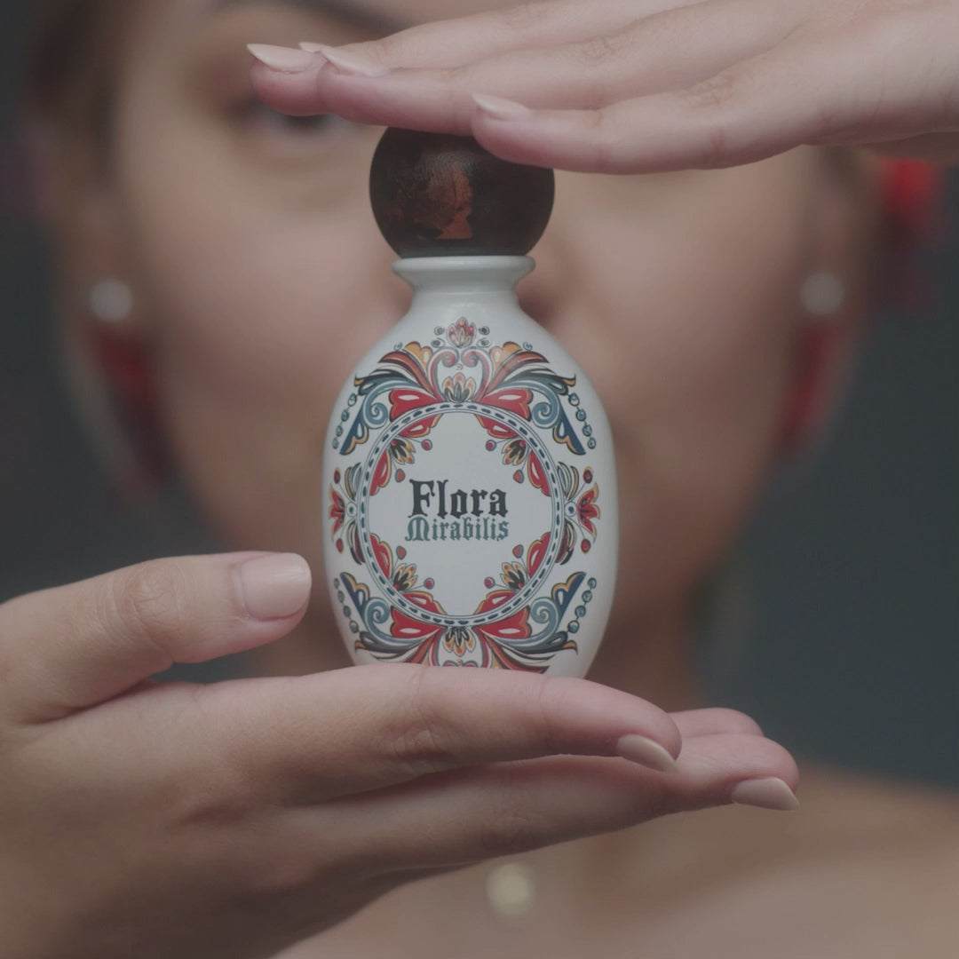 A video featuring multiple models applying Flora Mirabilis Holy Grail Face Oil, showing the product texture, facial massage techniques, and glowing finished results across different skin types.