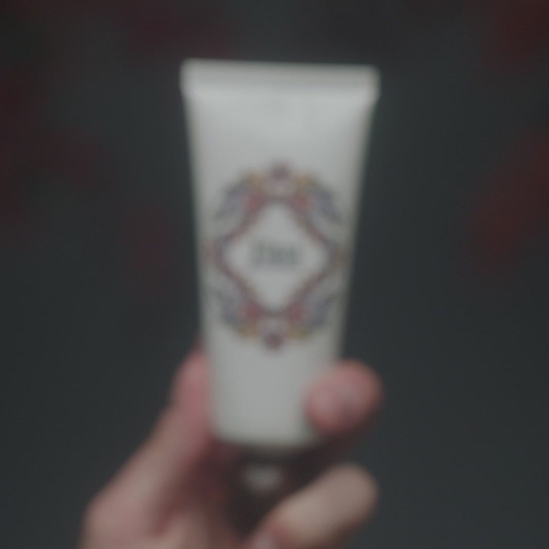 A video featuring multiple models applying Flora Mirabilis Fountain Of Youth Cleansing Clay, showing the product texture, facial massage techniques, and glowing finished results across different skin types.